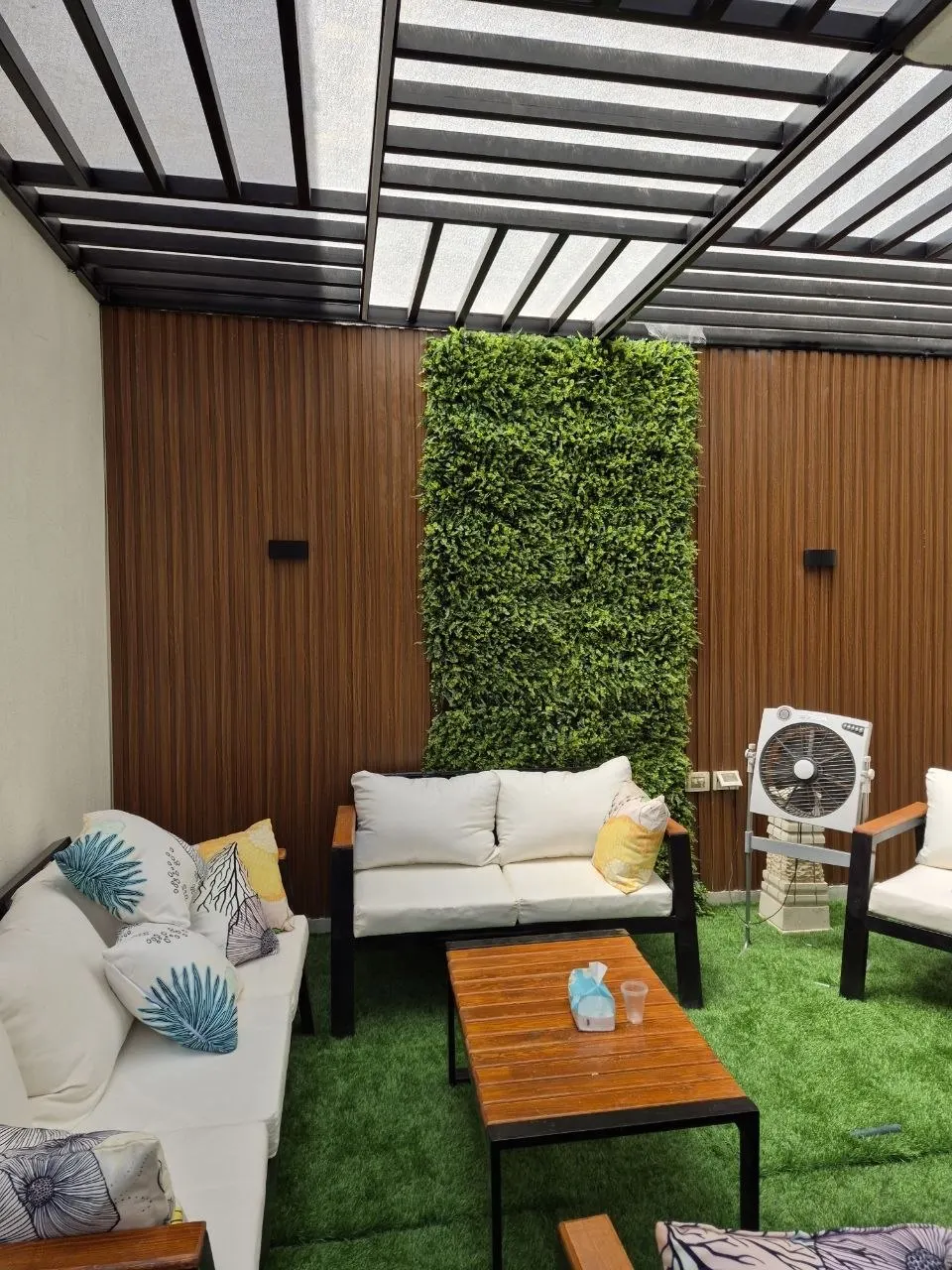 Timber-clad courtyard wall and seating