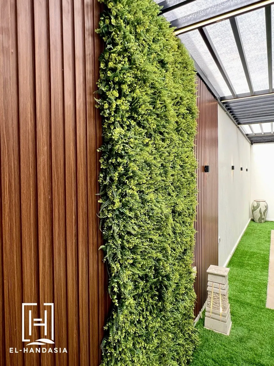 Vertical planting wrapping the far end of the courtyard