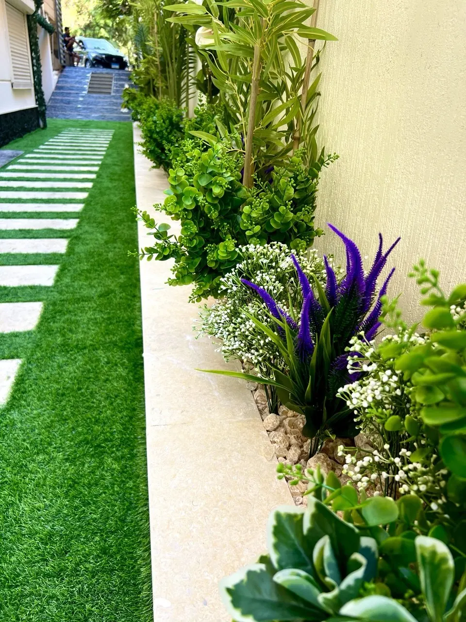 The side garden walkway approaching the house